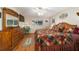 Bedroom with hardwood floors, large bed, matching dresser and decor at 9153 Sw 83Rd Ter # E, Ocala, FL 34481