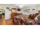 Bedroom with hardwood floors, large bed, matching dresser and decor at 9153 Sw 83Rd Ter # E, Ocala, FL 34481