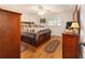 Bedroom with hardwood floors, matching dresser and decor at 9153 Sw 83Rd Ter # E, Ocala, FL 34481
