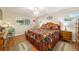 Comfortable bedroom with natural light, hardwood floors, and matching nightstands at 9153 Sw 83Rd Ter # E, Ocala, FL 34481