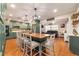 Spacious kitchen featuring a large island with seating, modern appliances, and hardwood flooring at 9153 Sw 83Rd Ter # E, Ocala, FL 34481