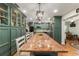 Beautiful kitchen showcasing custom cabinets, granite countertops, a large island, and stainless steel appliances at 9153 Sw 83Rd Ter # E, Ocala, FL 34481