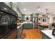 Modern kitchen with stainless steel appliances, custom cabinets, and ample counter space at 9153 Sw 83Rd Ter # E, Ocala, FL 34481