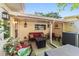 Inviting outdoor patio with comfortable seating and a modern fire pit at 9153 Sw 83Rd Ter # E, Ocala, FL 34481