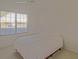 Cozy bedroom with a ceiling fan and a window bringing in natural light at 9325 Se 132Nd Pl, Summerfield, FL 34491