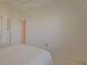 Cozy bedroom with a ceiling fan and a window bringing in natural light at 9325 Se 132Nd Pl, Summerfield, FL 34491