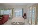 Cozy dining area features a large table, decorative hutch, and sliding glass doors to the patio at 9325 Se 132Nd Pl, Summerfield, FL 34491