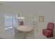 Bright dining room with a decorative hutch, unique chandelier, and comfortable seating at 9325 Se 132Nd Pl, Summerfield, FL 34491