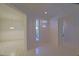 Spacious foyer featuring tile floors and an entrance door with sidelight windows at 9325 Se 132Nd Pl, Summerfield, FL 34491
