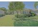 Charming home with lush front yard, mature trees, and manicured landscaping at 9325 Se 132Nd Pl, Summerfield, FL 34491