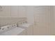 Clean laundry room features a washer, dryer and storage cabinets at 9325 Se 132Nd Pl, Summerfield, FL 34491