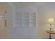 Living room featuring built-in bookshelves with decorative cabinets at 9325 Se 132Nd Pl, Summerfield, FL 34491