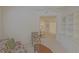 View of the living room with floral sofa and chair, built in bookshelves and view to Kitchen at 9325 Se 132Nd Pl, Summerfield, FL 34491