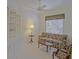 Bright living room featuring a built in bookshelf and comfortable seating at 9325 Se 132Nd Pl, Summerfield, FL 34491