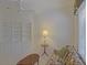 Well-lit living room with built in bookshelves, floral sofa, and an oval coffee table at 9325 Se 132Nd Pl, Summerfield, FL 34491