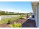 This spacious backyard features a lush lawn, white picket fence, and well-maintained landscaping at 9573 Sw 79Th Loop, Ocala, FL 34481