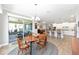 Open dining area with a view of the kitchen and outdoor patio space at 9573 Sw 79Th Loop, Ocala, FL 34481