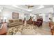 Open-concept living room with a decorative rug and comfortable furniture at 9573 Sw 79Th Loop, Ocala, FL 34481