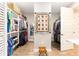 Walk-in closet features wood floors, custom shelving, and ample storage space at 9573 Sw 79Th Loop, Ocala, FL 34481