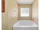 Bright bathtub with window at 9896 Sw 56Th Ct, Ocala, FL 34476