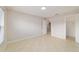 Well-lit bedroom featuring tile flooring and an open closet door at 9896 Sw 56Th Ct, Ocala, FL 34476