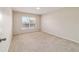 Neutral bedroom featuring plush carpeting and a bright, sunny window at 9896 Sw 56Th Ct, Ocala, FL 34476