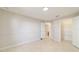 Neutral bedroom with tile floor showing closet and bathroom entrances at 9896 Sw 56Th Ct, Ocala, FL 34476
