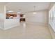 Open concept dining area showcasing tile flooring and a view into the adjacent kitchen space at 9896 Sw 56Th Ct, Ocala, FL 34476
