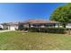 Attractive single-story home featuring a well-maintained lawn, mature bushes, and a convenient two-car garage at 9896 Sw 56Th Ct, Ocala, FL 34476