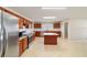 Kitchen featuring stainless steel appliances, granite countertops, and a center island with seating at 9896 Sw 56Th Ct, Ocala, FL 34476
