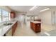 Bright kitchen with granite countertops, stainless steel dishwasher, and a convenient center island at 9896 Sw 56Th Ct, Ocala, FL 34476