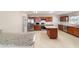 Well-equipped kitchen with stainless steel appliances and granite countertops, spacious kitchen island at 9896 Sw 56Th Ct, Ocala, FL 34476