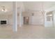 Bright living area with a fireplace, tiled floors, and modern lighting fixtures at 9896 Sw 56Th Ct, Ocala, FL 34476