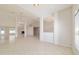 Spacious living room with tile flooring, fireplace, and bright natural light at 9896 Sw 56Th Ct, Ocala, FL 34476