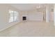 Bright living room featuring a fireplace, tile flooring, and a vaulted ceiling with a fan at 9896 Sw 56Th Ct, Ocala, FL 34476