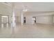 Open-concept living area with views of the entryway and modern kitchen at 9896 Sw 56Th Ct, Ocala, FL 34476