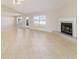 Spacious living area with a fireplace and plenty of natural light at 9896 Sw 56Th Ct, Ocala, FL 34476
