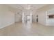 Open floor plan showcasing the living area with a seamless flow to the kitchen at 9896 Sw 56Th Ct, Ocala, FL 34476