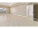 Inviting living room offers tile flooring, neutral paint, and plenty of room for furniture arrangements at 9896 Sw 56Th Ct, Ocala, FL 34476