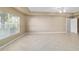 Bright living room featuring natural light, neutral paint, tile flooring, and ample space for relaxation at 9896 Sw 56Th Ct, Ocala, FL 34476