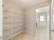 Walk-in pantry featuring wire shelving for optimal storage and organization with easy access at 9896 Sw 56Th Ct, Ocala, FL 34476