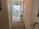 Hallway leading to the bathroom features plenty of storage and natural light at 9915 Sw 47Th Ave, Ocala, FL 34476