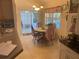 Charming dining area with views of the backyard pool through sliding glass doors at 9915 Sw 47Th Ave, Ocala, FL 34476