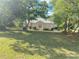 Lovely single-story home featuring mature trees, a well-maintained lawn, and a tranquil setting at 9915 Sw 47Th Ave, Ocala, FL 34476