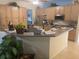 Bright kitchen with lots of cabinets, an island, and modern appliances at 9915 Sw 47Th Ave, Ocala, FL 34476