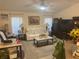 Inviting living room with a comfortable sofa, patterned rug, and natural light at 9915 Sw 47Th Ave, Ocala, FL 34476
