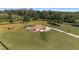 Spacious property featuring a well-manicured lawn and outdoor basketball court at 9950 Nw 11Th Ter, Ocala, FL 34475