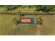 Aerial view of outdoor basketball court surrounded by palm trees at 9950 Nw 11Th Ter, Ocala, FL 34475