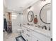 Beautiful bathroom featuring double vanity, marble countertops, and elegant fixtures at 9950 Nw 11Th Ter, Ocala, FL 34475