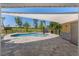 An outdoor pool area featuring pool, shade and patio at 9950 Nw 11Th Ter, Ocala, FL 34475